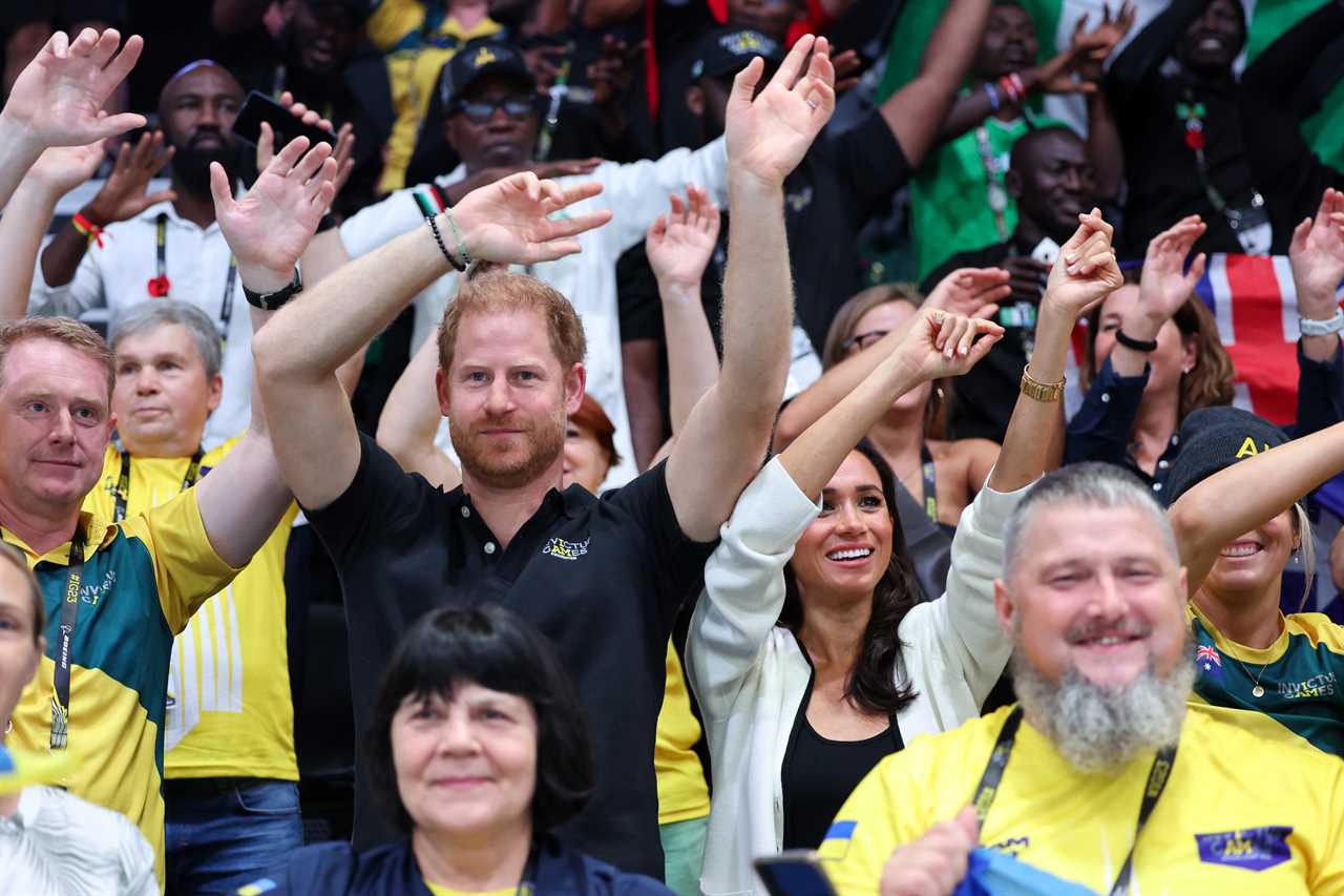 Meghan Markle and Prince Harry beam as they arrive to watch wheelchair basketball at Invictus Games in Germany