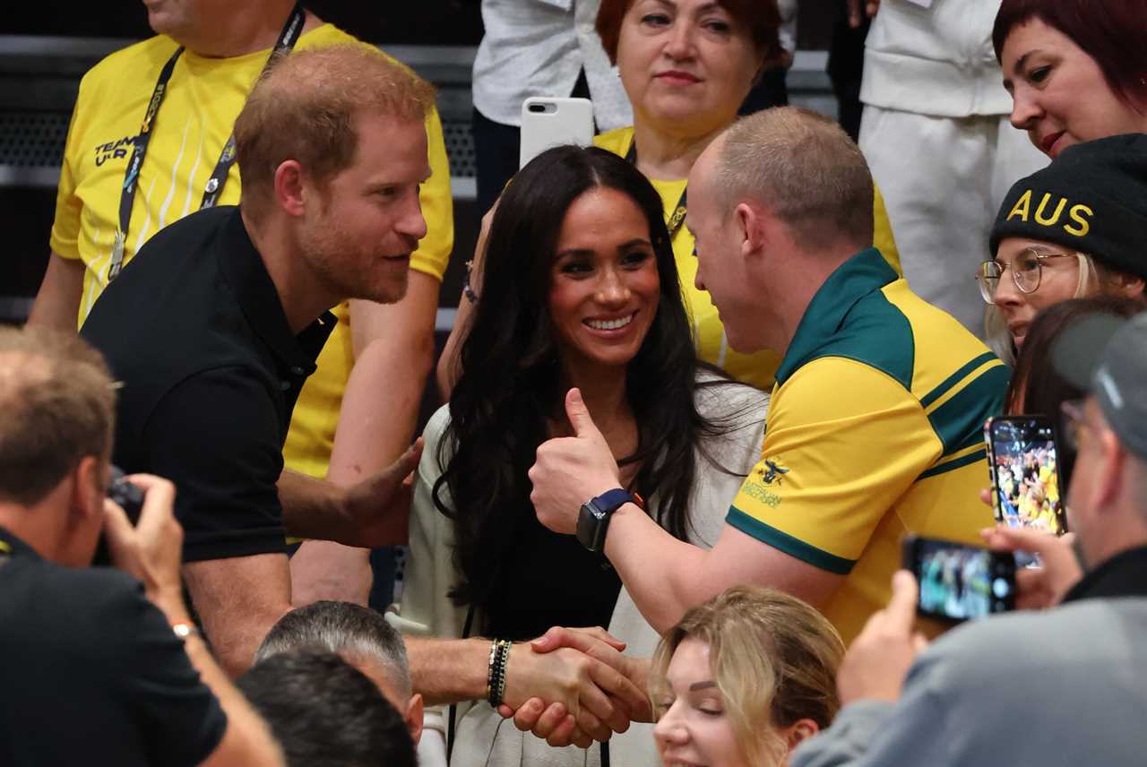 Meghan Markle and Prince Harry beam as they arrive to watch wheelchair basketball at Invictus Games in Germany