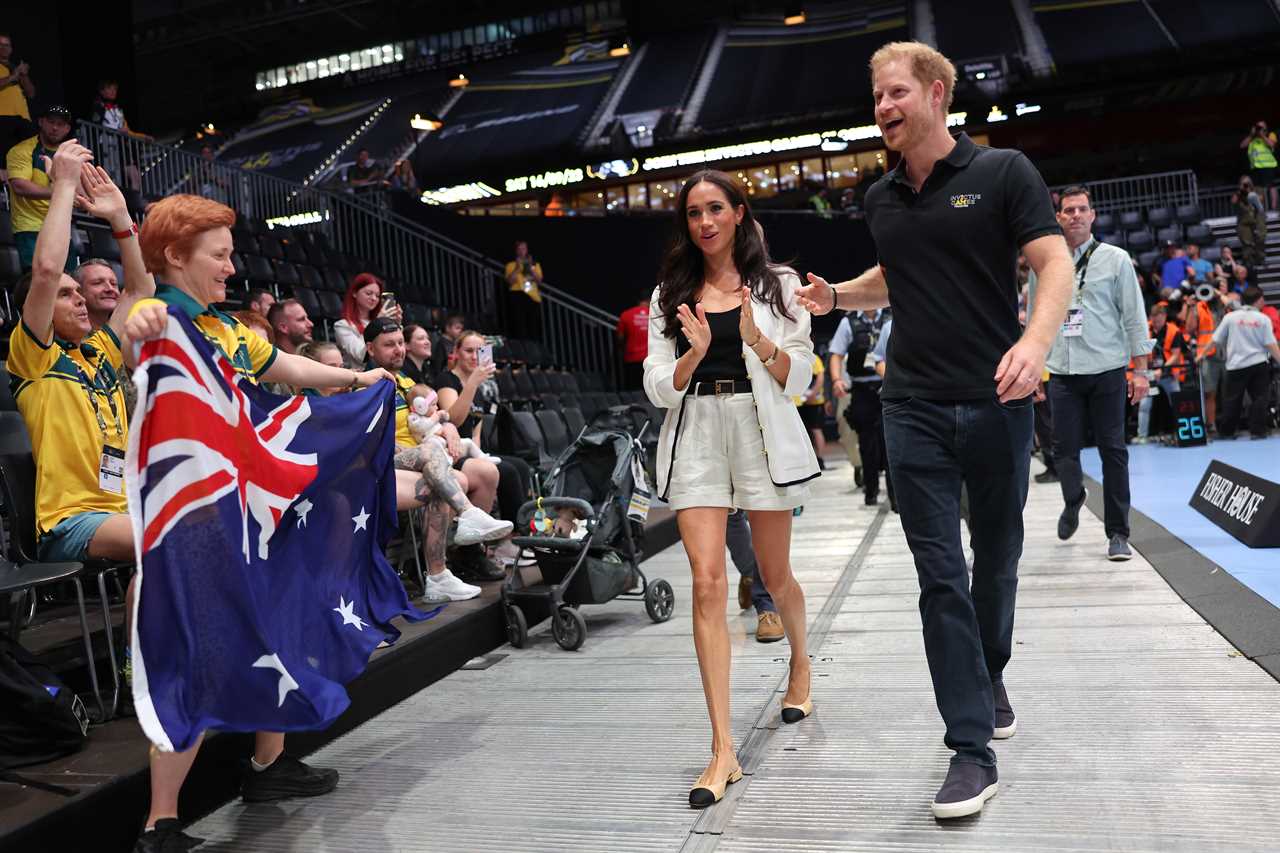 Meghan Markle and Prince Harry beam as they arrive to watch wheelchair basketball at Invictus Games in Germany