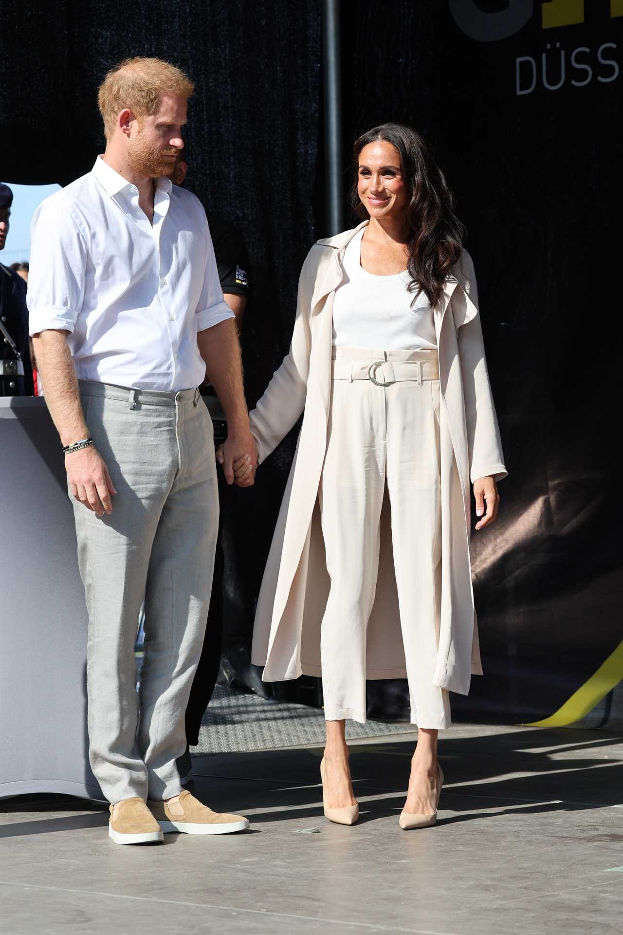 Meghan Markle and Prince Harry hold hands as they appear for last day of Invictus Games