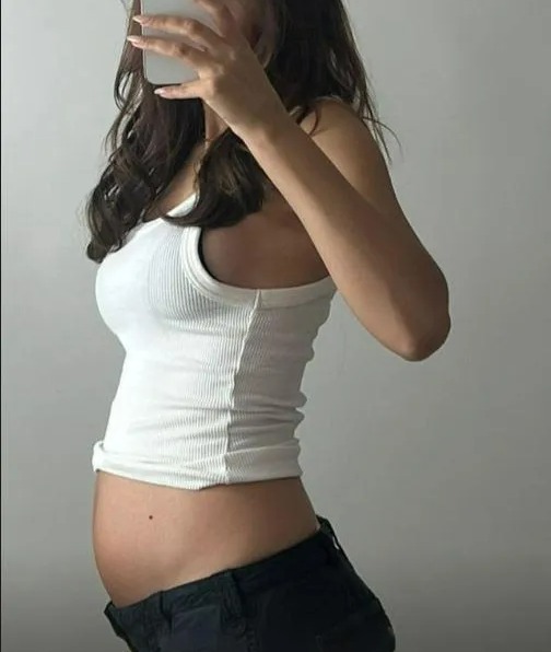 Pregnant Lucy Watson shares adorable baby bump photo as fans react