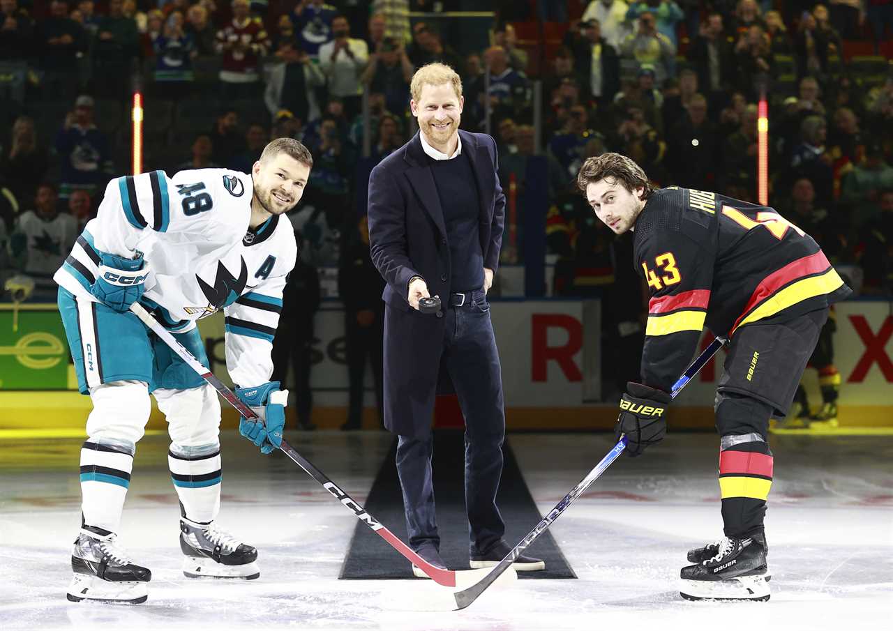 Prince Harry told to drop hockey puck by star as he's too busy smiling for photos