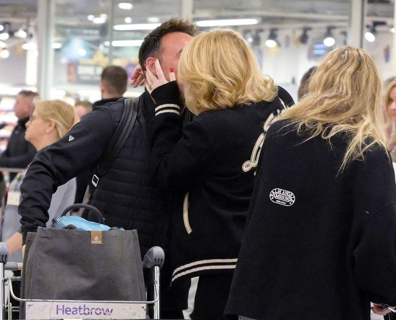 Ant McPartlin shares a passionate kiss with wife Anne-Marie as they reunite at Heathrow Airport