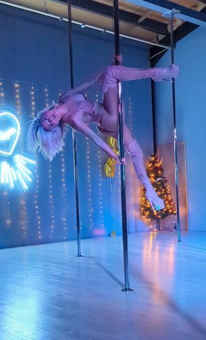 Hollyoaks Star Sarah Jayne Dunn Wows Fans with Pole Dancing Skills in Thong and Thigh High Boots