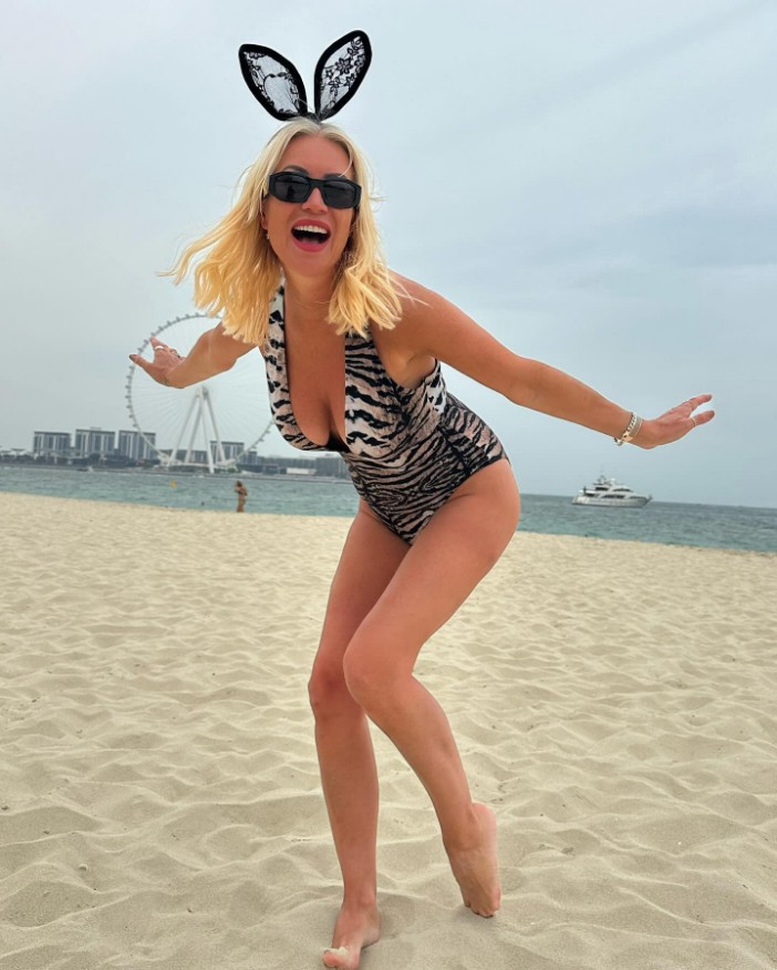 Denise Van Outen stuns in daring animal print swimsuit and bunny ears in Dubai