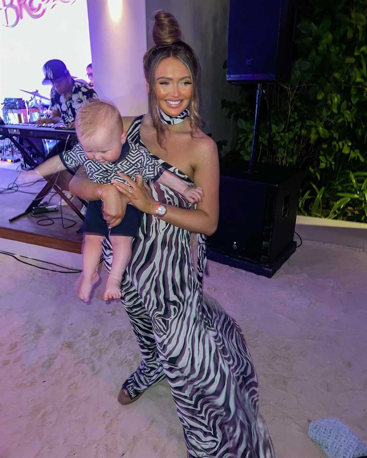 Charlotte Dawson flaunts stunning weight loss in zebra print dress on lavish family getaway in the Maldives