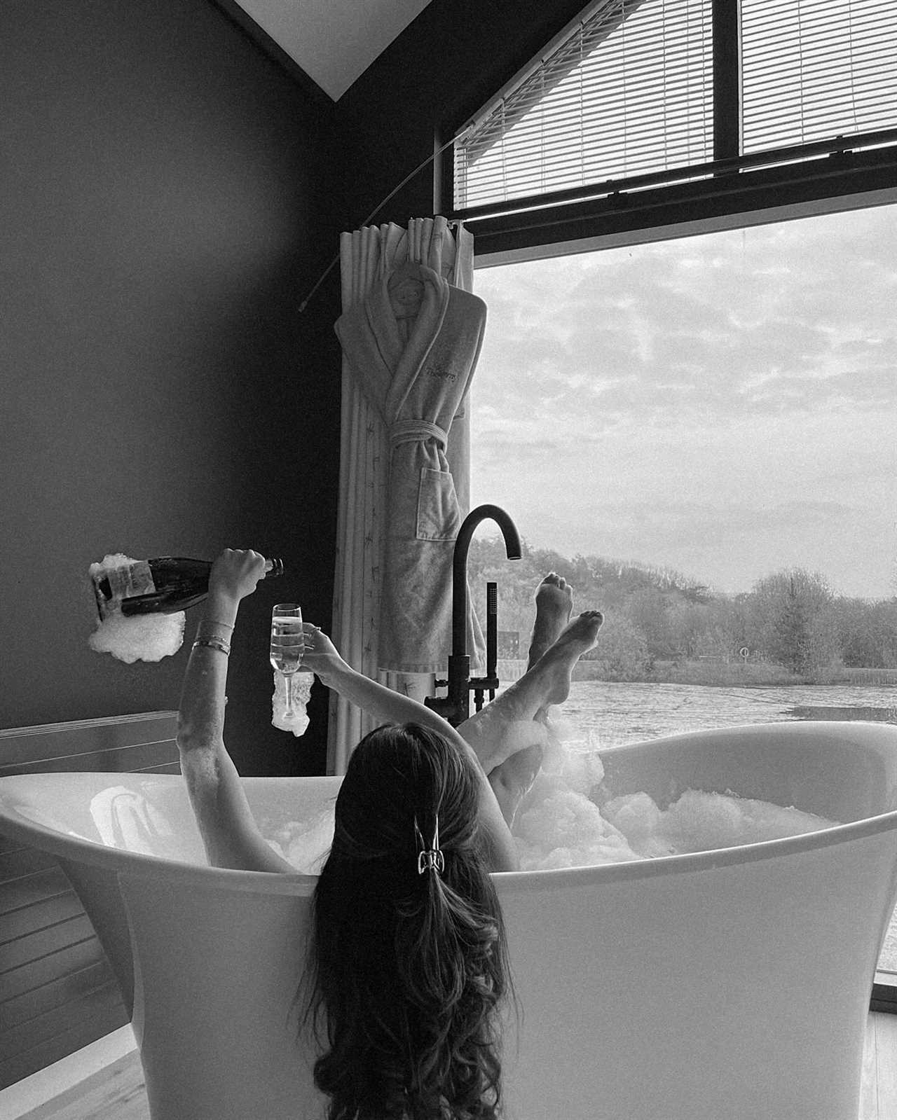 Maura Higgins Enjoys a Luxurious Bath with Champagne Amidst Split