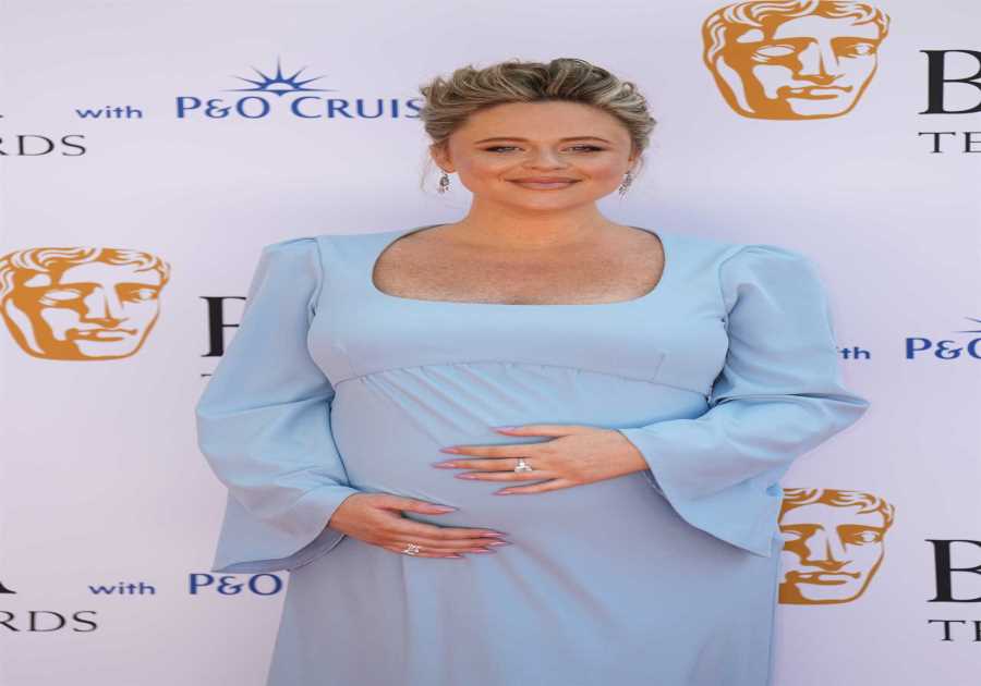 Emily Atack stuns in baby blue gown at Baftas, cradling her baby bump