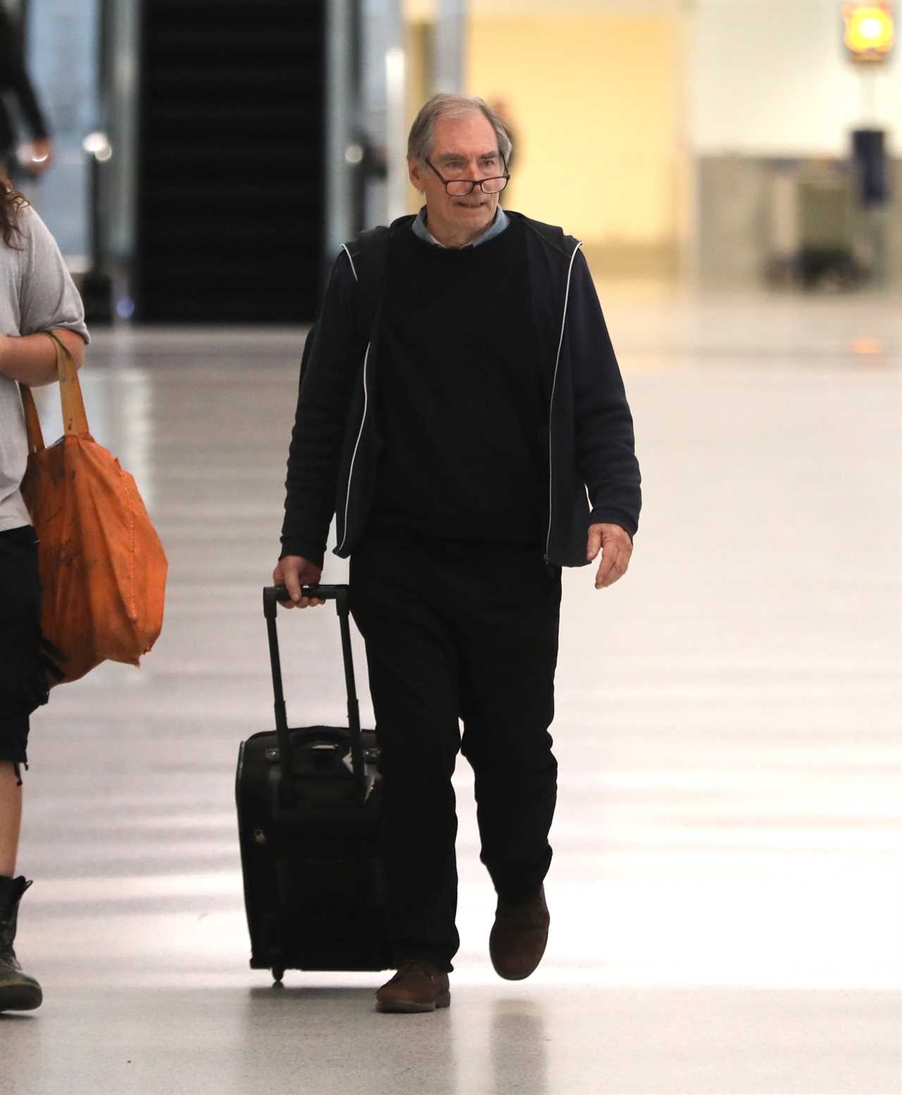 British movie legend, 78, unrecognisable from Hollywood roles as he lands in LA