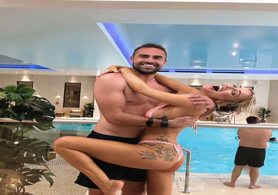 Laura Anderson wows in bikini as she wraps her legs around footballer boyfriend on £700 a night break