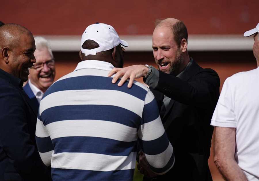 Prince William kicks off South Africa trip with touch rugby game