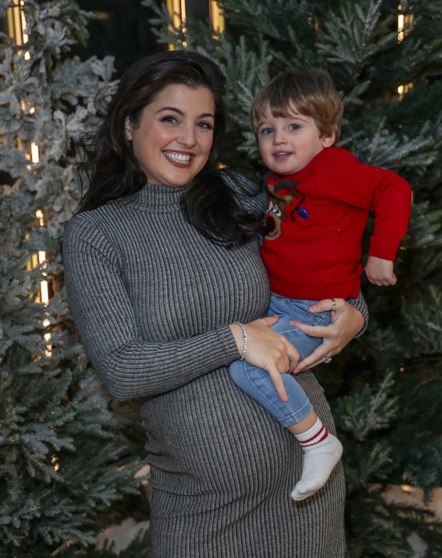 Pregnant Storm Huntley flaunts baby bump during night out with son Otis