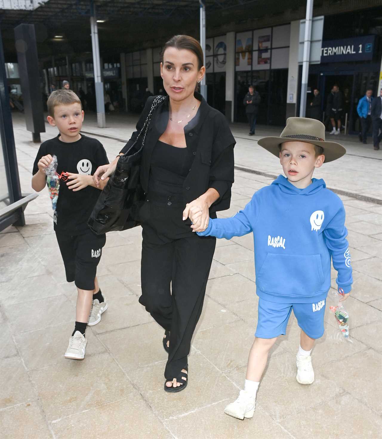 Coleen Rooney back in the UK wearing her 'taxi-driver-mum' hat after I'm A Celebrity success