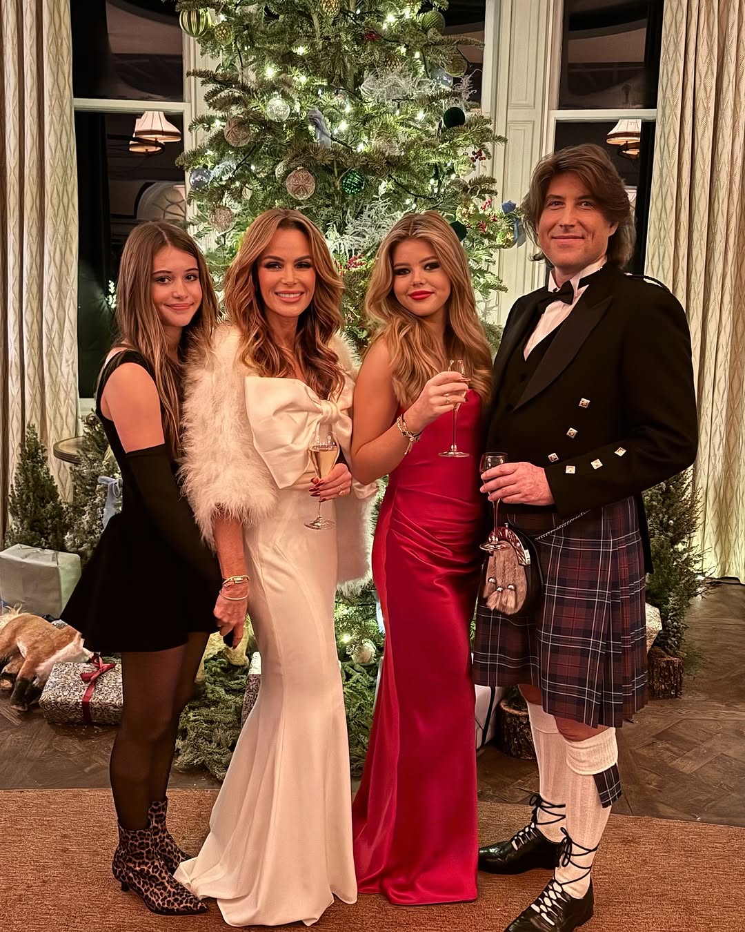 Amanda Holden stuns in white gown with lookalike daughters for New Year celebrations