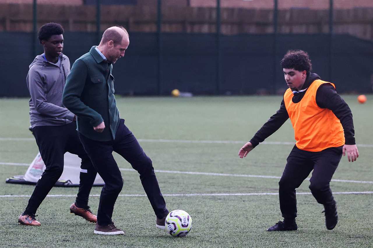 Prince Charles plays football with teenagers in Toxteth