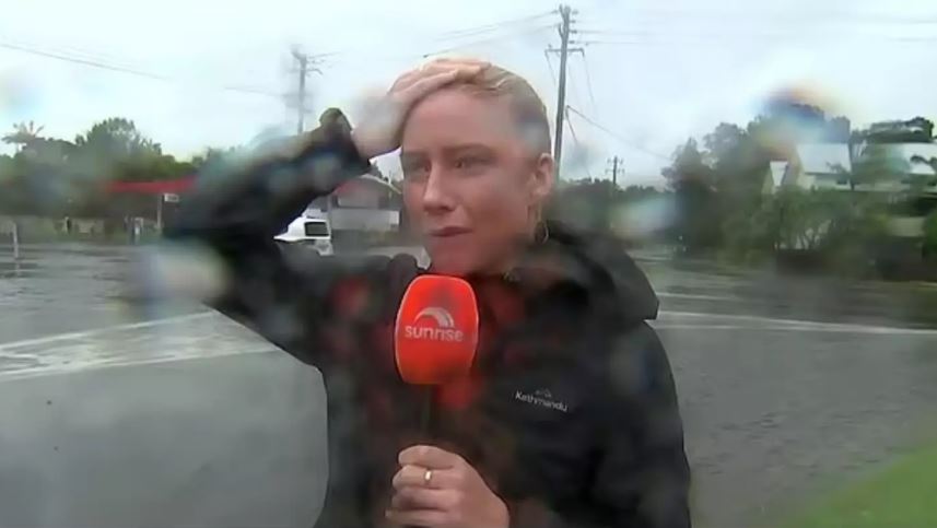 Reporter stops live on air to rant at 'dangerous' driver during Cyclone Alfred coverage