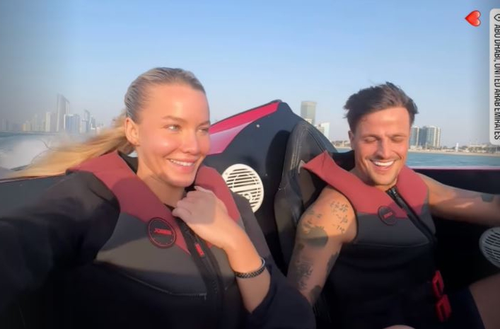 Grace Jackson and Luca Bish on a speedboat in Abu Dhabi.